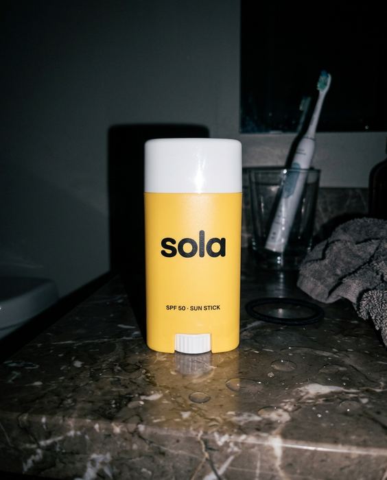 SOLA concept brand, spf 50 sun stick: Flash on, bathroom counter
