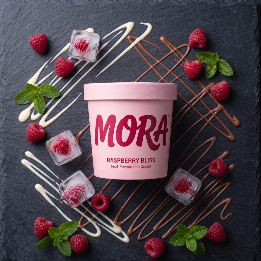 AI generated product photography for MORA Raspberry Bliss ice cream brand — slate drizzle flat lay