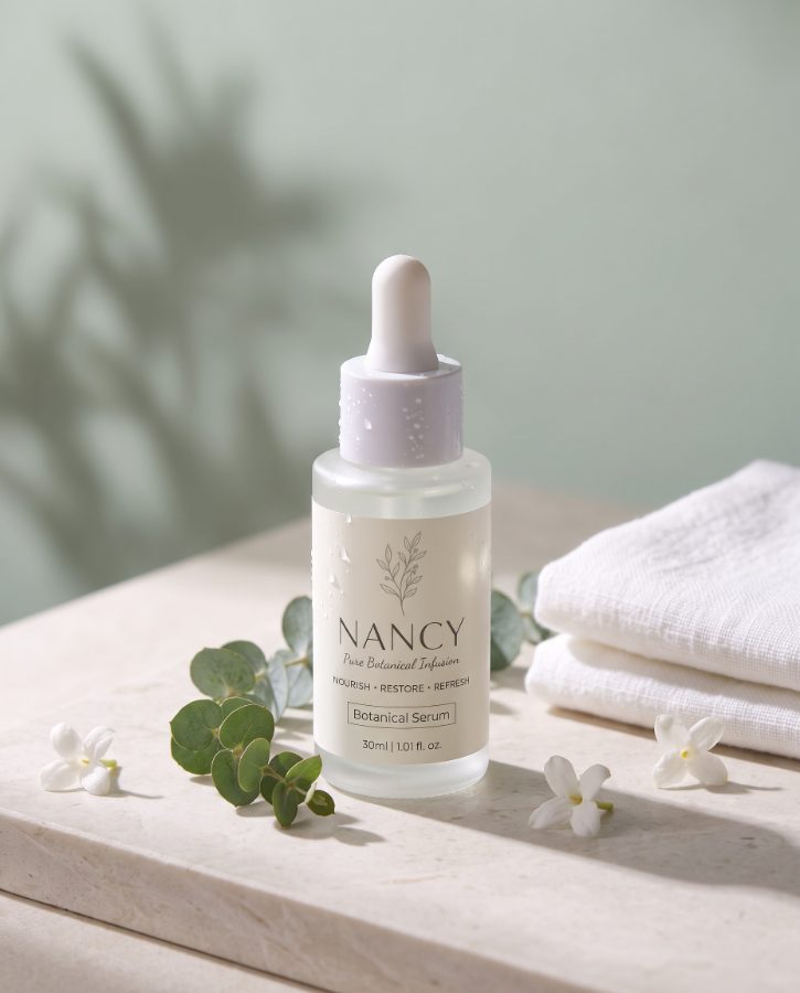 AI skincare product photography for Nancy Botanical Serum brand — stone ledge hero shot