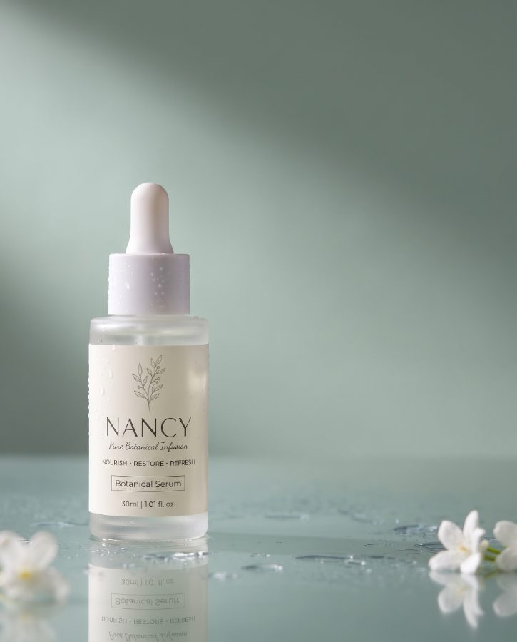 AI skincare product photography for Nancy Botanical Serum brand — dropper splash